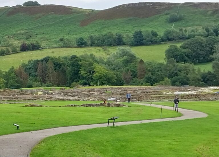 People walk the trails to view the Roman fort ruins.