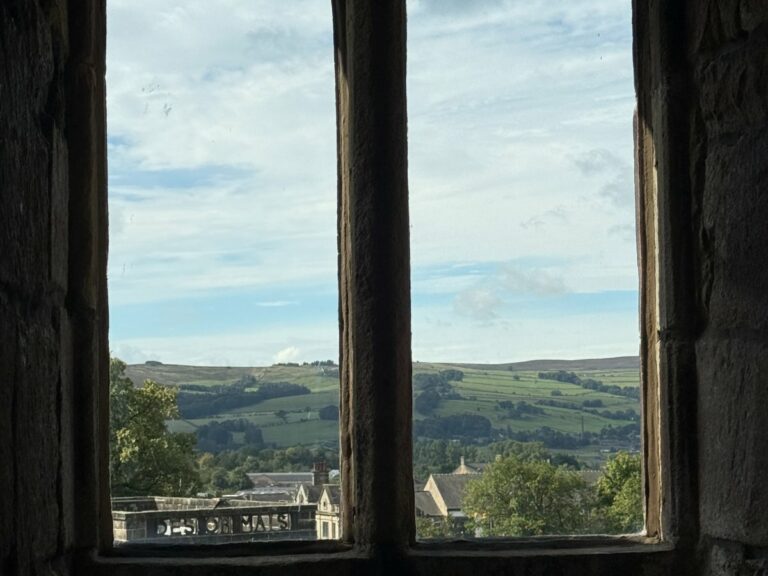 Views of the countryside from the window of a historical castle.