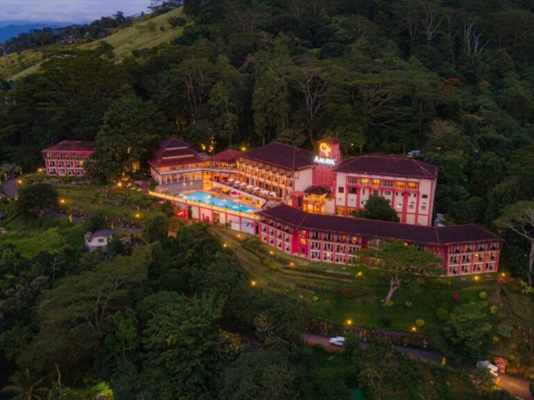 Aerial image of mountain resort, grounds and pool.
