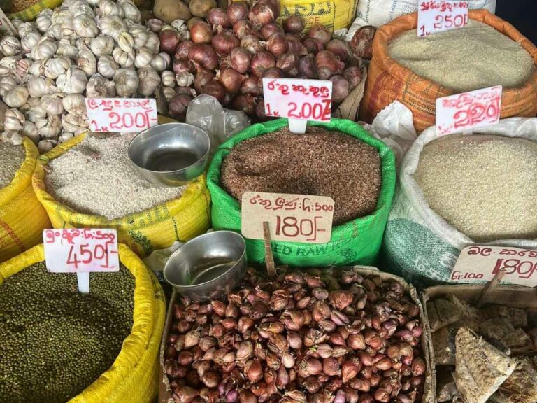 Bags of different spices and nuts and other fresh food sold at the local food market.